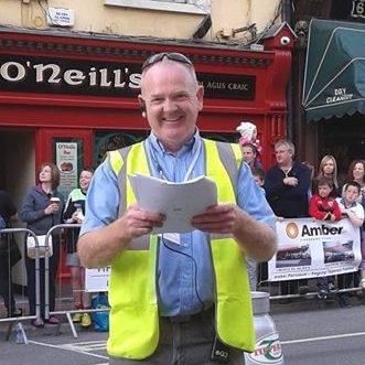 Photograph of Stevie O'Donnell on a Tipperary street wearing a high viz bib